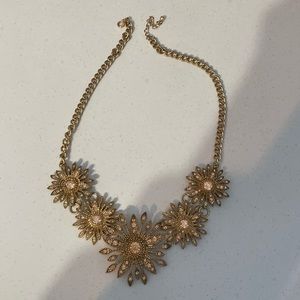 Gold necklace.